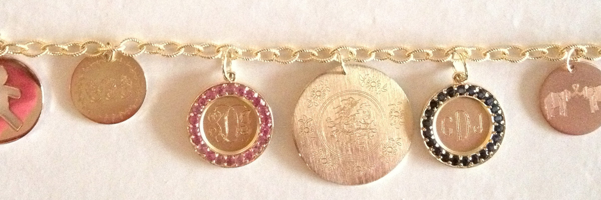 Emily & Ashley engraved gold discs on a charm bracelet