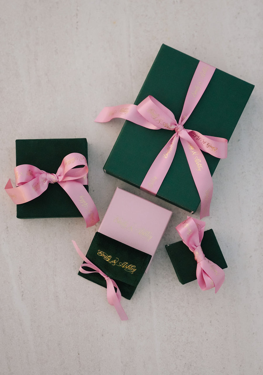 Emily and Ashley gift boxes with pink ribbon