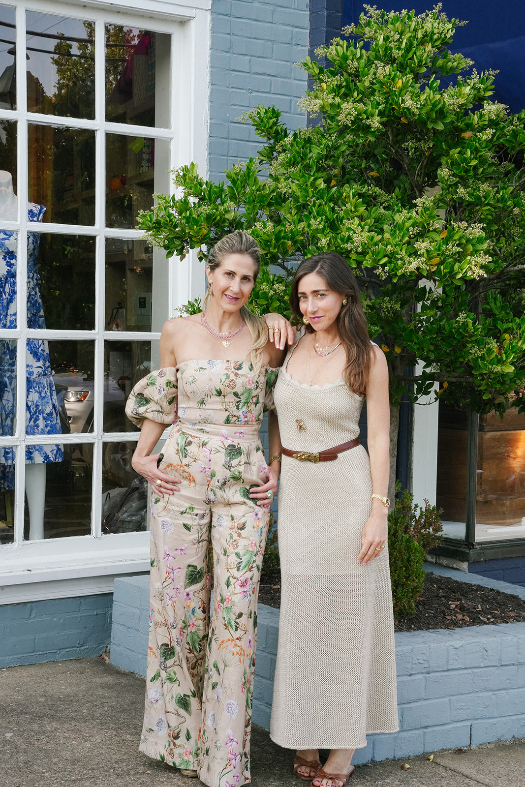 Emily and Ashley outside a shop on a trunk show day