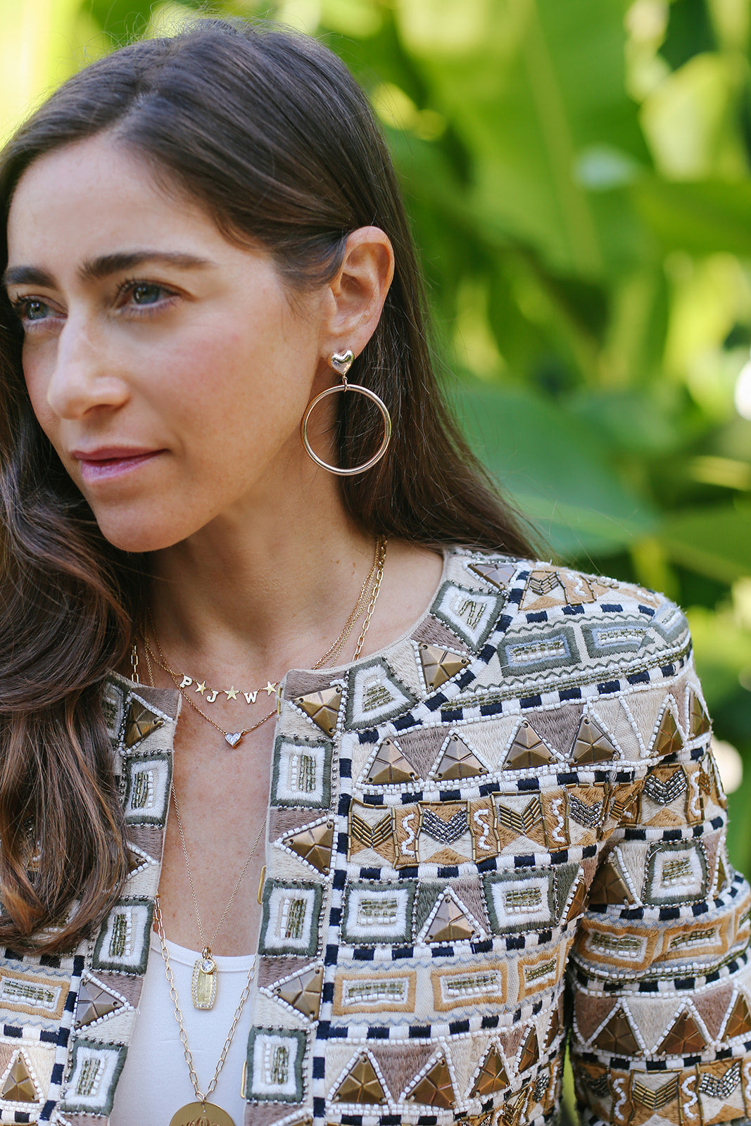 Portrait wearing Emily and Ashley gold hoops and pendants