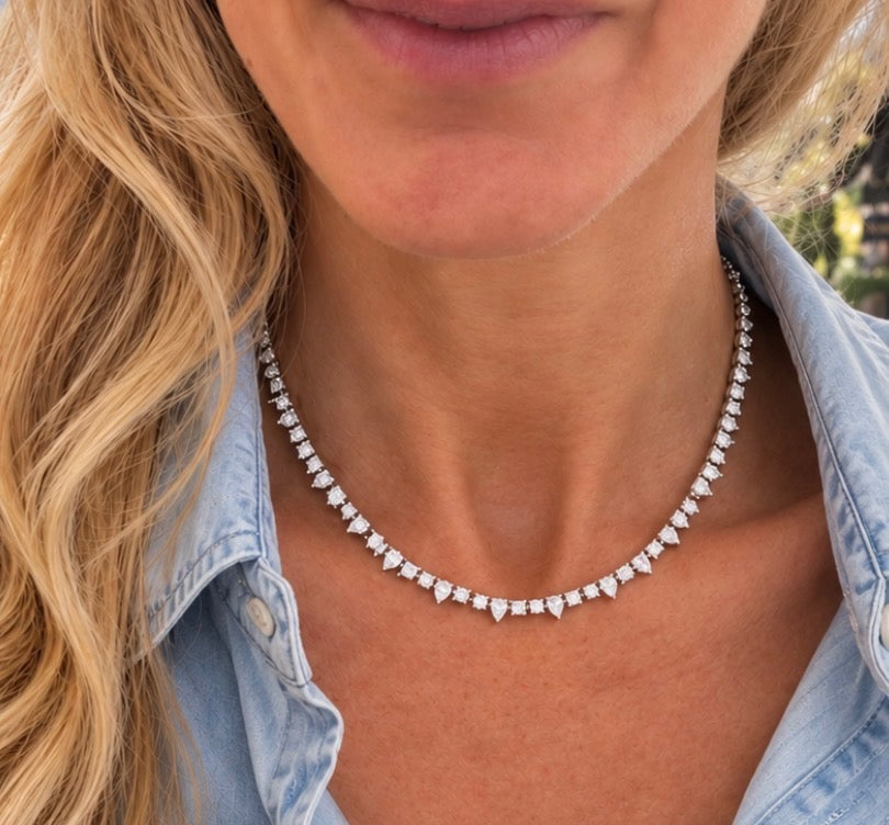 Diamond necklace worn with a denim shirt