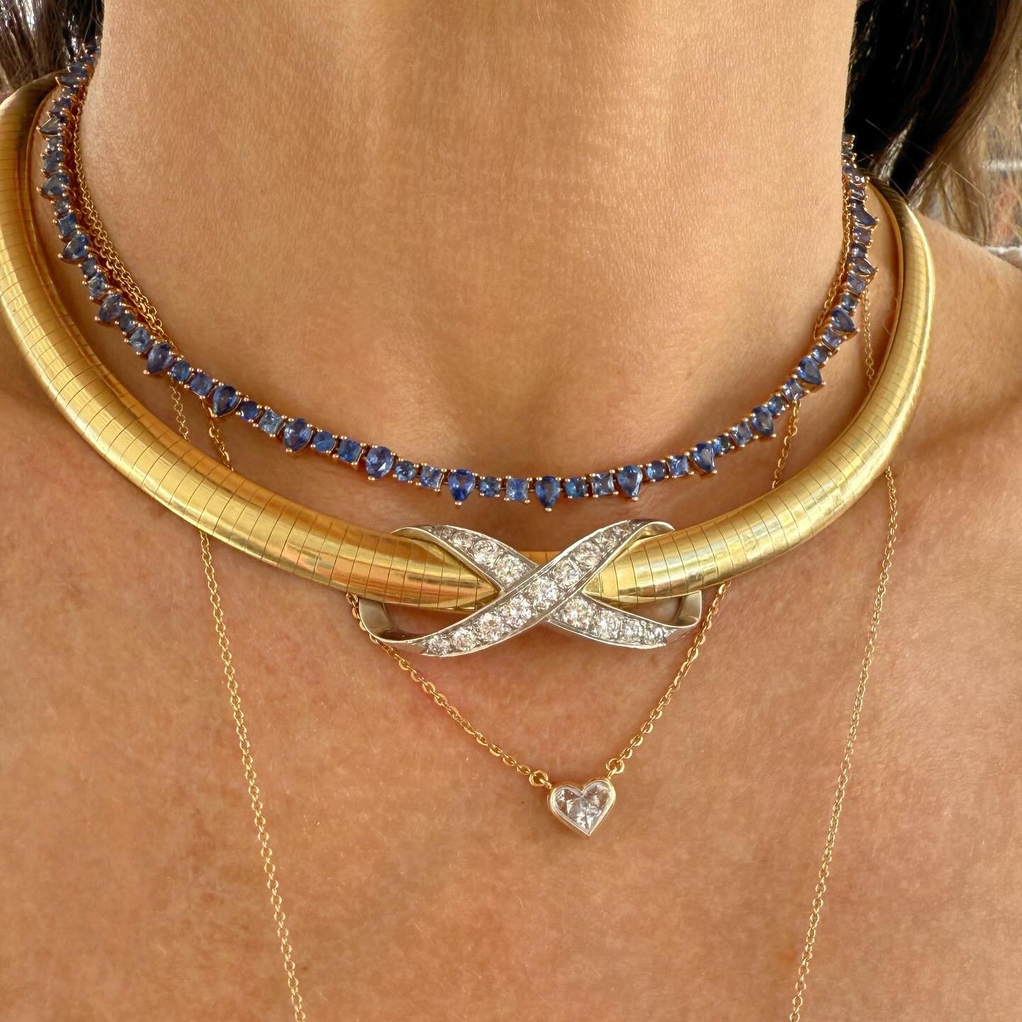 Sapphire necklace and gold collar with a diamond heart