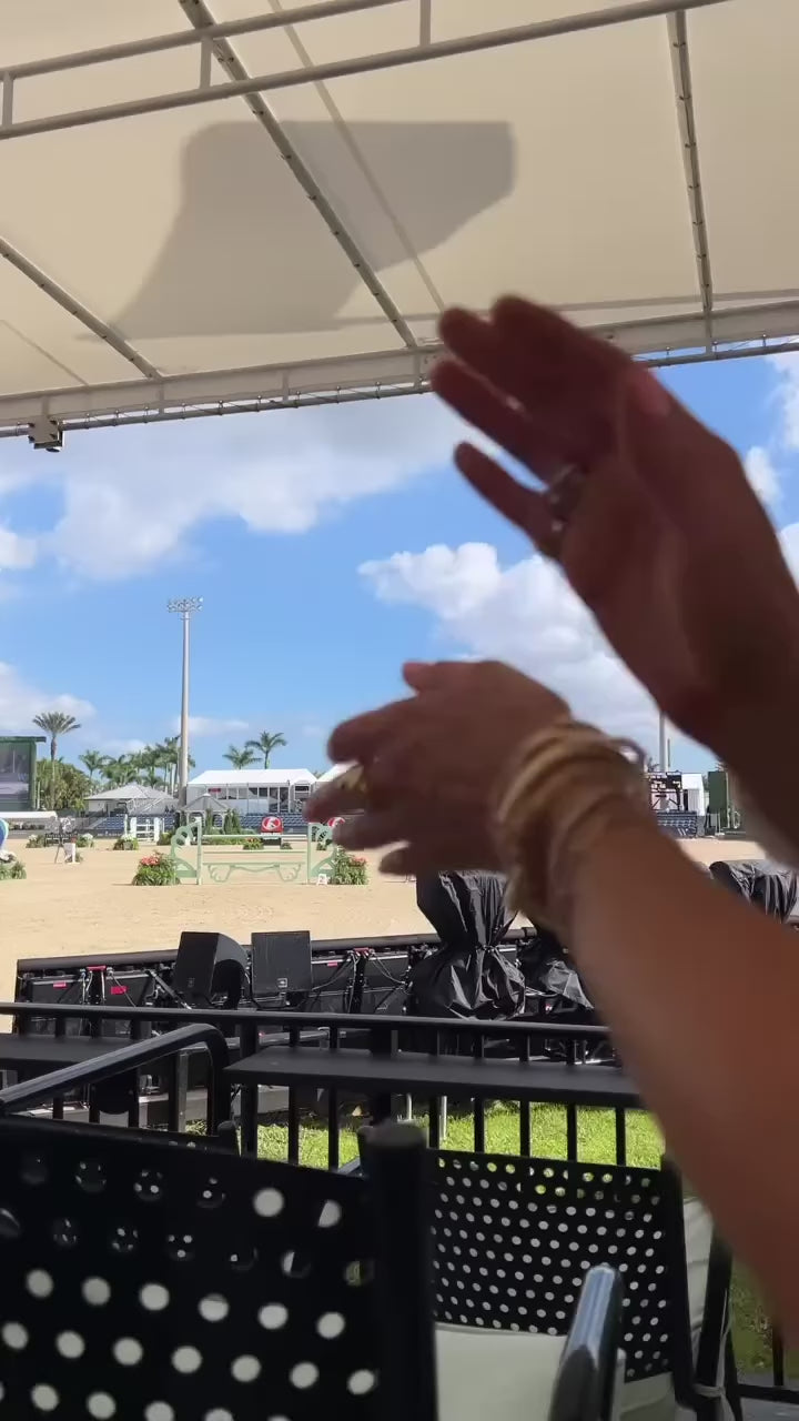 Ringside at the Winter Equestrian Festival in Wellington, wearing Emily and Ashley rings and bracelets